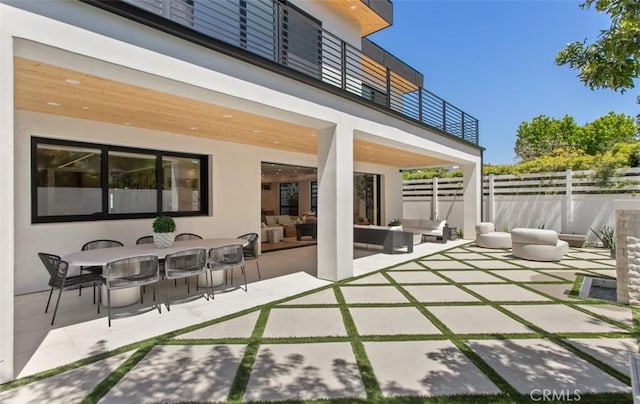 5772 Sierra Casa Rd, Irvine, CA 92603 - view of patio with an outdoor living space, a balcony, and outdoor dining space