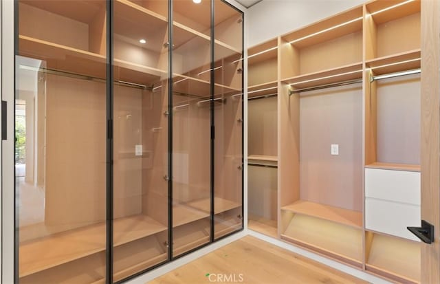5772 Sierra Casa Rd, Irvine, CA 92603 - walk in closet featuring wood finished floors