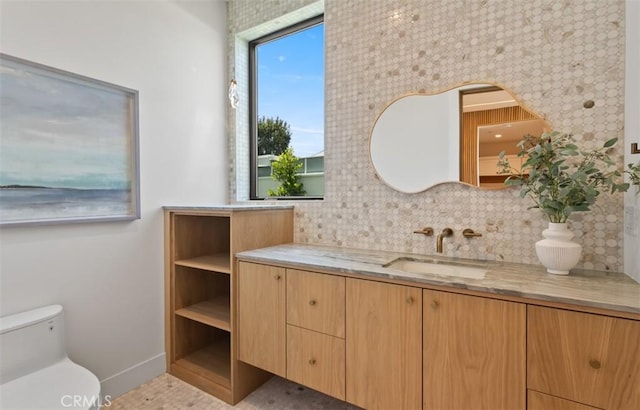 5772 Sierra Casa Rd, Irvine, CA 92603 - bathroom with vanity, toilet, decorative backsplash, and baseboards