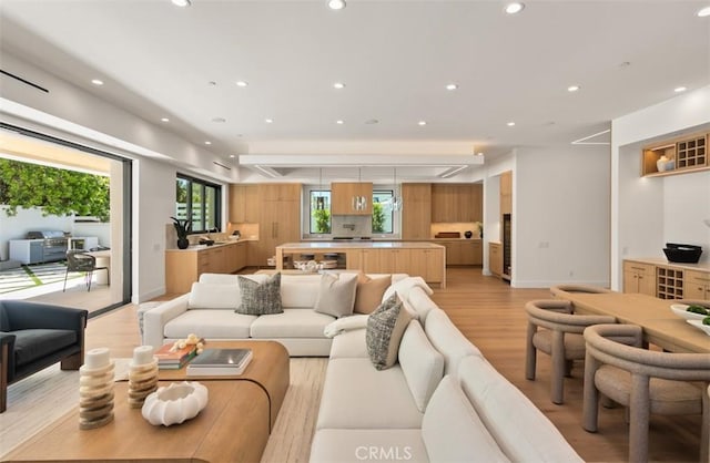 5772 Sierra Casa Rd, Irvine, CA 92603 - living area with light wood-style flooring, recessed lighting, and baseboards