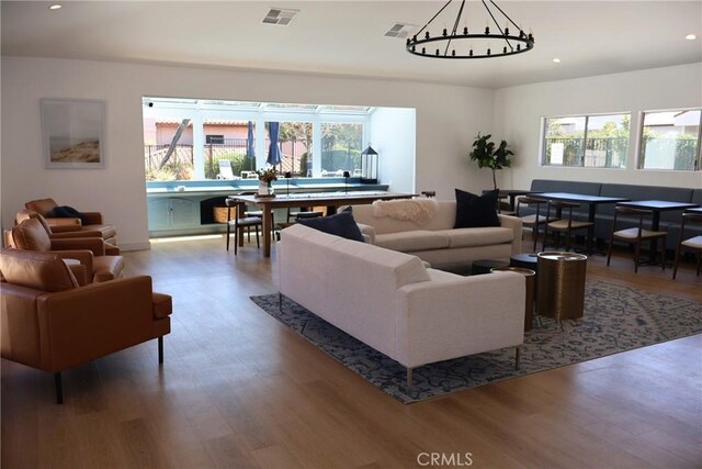 6508 Sandy Point Ct, Rancho Palos Verdes, CA 90275 - living area featuring a chandelier, wood finished floors, plenty of natural light, and recessed lighting