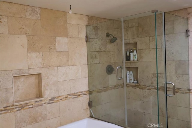 bathroom featuring a shower stall