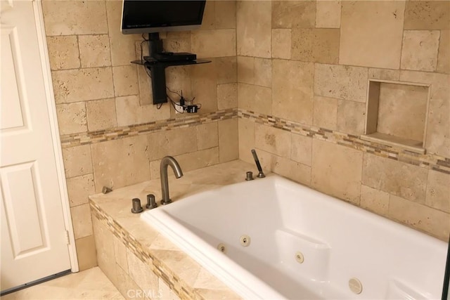 full bathroom with a jetted tub