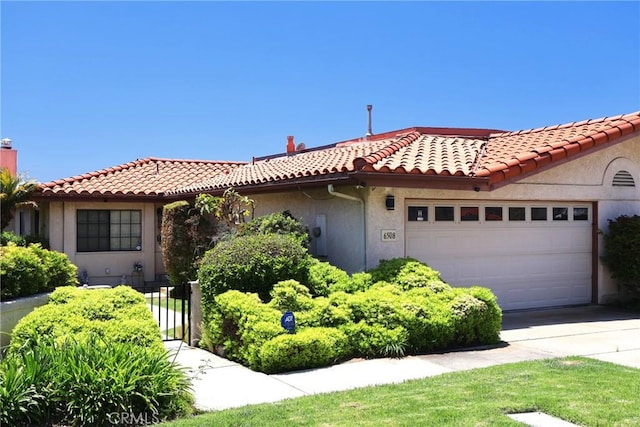 6508 Sandy Point Ct, Rancho Palos Verdes, CA 90275 - mediterranean / spanish house featuring a garage, concrete driveway, stucco siding, and a tile roof