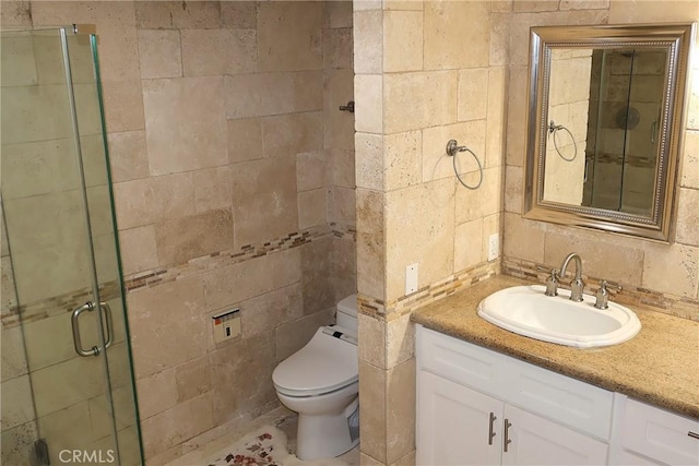 full bath with tile walls, a stall shower, toilet, vanity, and backsplash