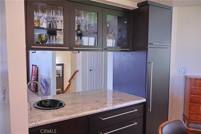 bar area featuring a sink