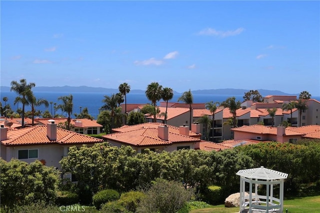 view of mountain background featuring nearby suburban area
