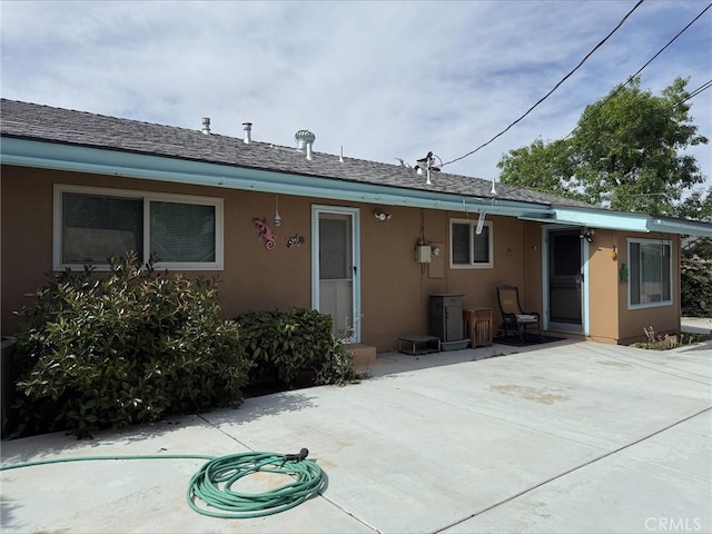 35014 Shasta St, Yucaipa, CA 92399 - rear view of property featuring stucco siding, a patio, and roof with shingles