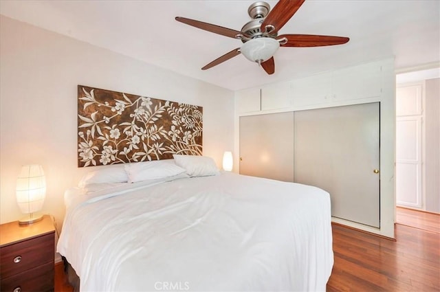 2049 Via Mariposa Unit E, Laguna Woods, CA 92637 - bedroom featuring dark wood-type flooring, a closet, and a ceiling fan