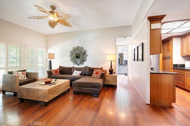 2049 Via Mariposa Unit E, Laguna Woods, CA 92637 - living area featuring a ceiling fan and hardwood / wood-style flooring