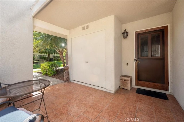 2049 Via Mariposa Unit E, Laguna Woods, CA 92637 - entrance to property featuring stucco siding