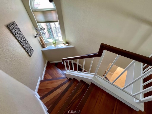 4166 Winged Foot Way, Chino Hills, CA 91709 - stairway with wood finished floors, a textured wall, and baseboards
