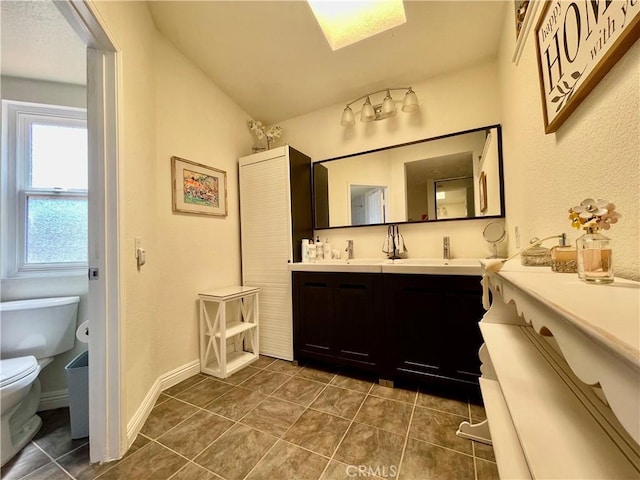 4166 Winged Foot Way, Chino Hills, CA 91709 - full bath featuring toilet, tile patterned floors, double vanity, and a skylight