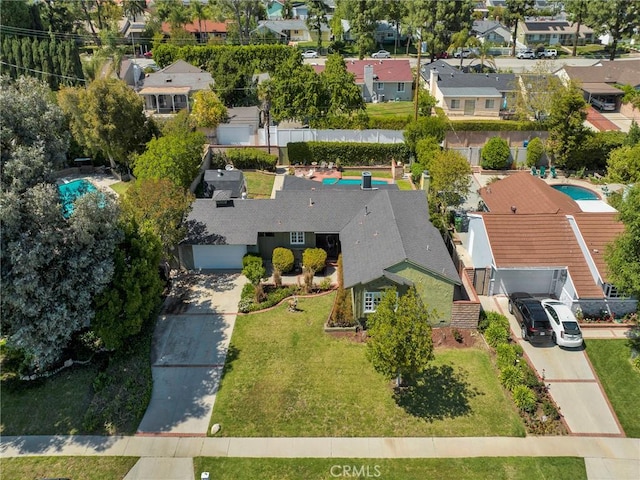 aerial perspective of suburban area featuring a pool area