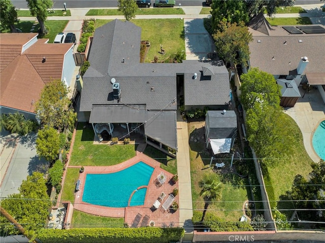 aerial perspective of suburban area featuring a pool area