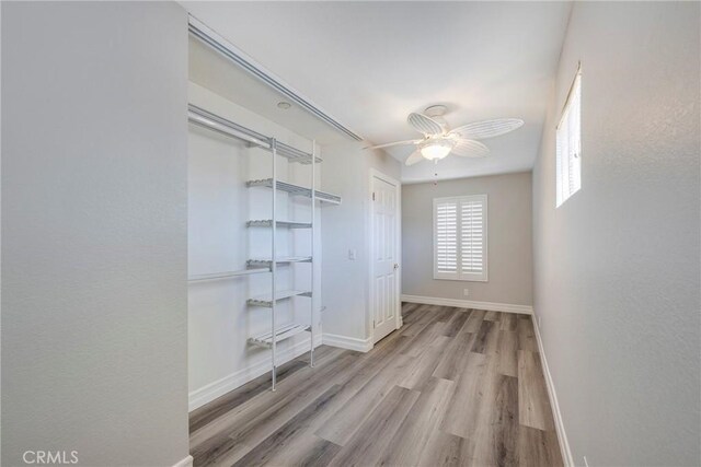 17275 Growers Cir, Yorba Linda, CA 92886 - unfurnished bedroom with wood finished floors, baseboards, ceiling fan, and a closet