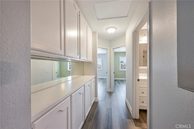 17275 Growers Cir, Yorba Linda, CA 92886 - corridor featuring dark wood-style flooring, a textured wall, and baseboards