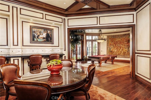 12 Skyridge, Newport Coast, CA 92657 - dining space with ornamental molding, pool table, a decorative wall, coffered ceiling, and dark wood finished floors