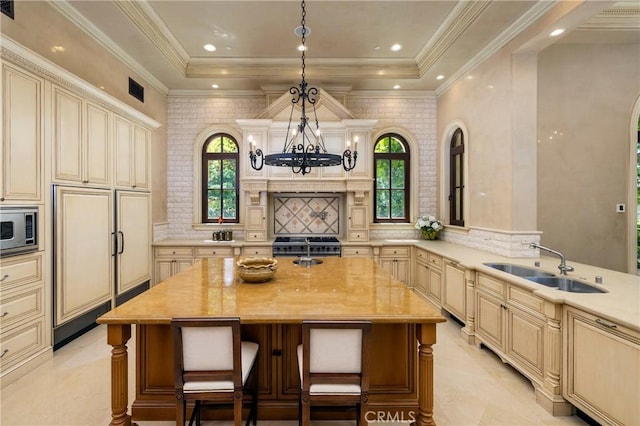 12 Skyridge, Newport Coast, CA 92657 - kitchen featuring stainless steel appliances, a sink, cream cabinets, and recessed lighting