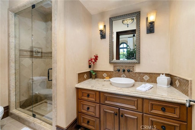 12 Skyridge, Newport Coast, CA 92657 - full bathroom with toilet, a stall shower, vanity, and backsplash