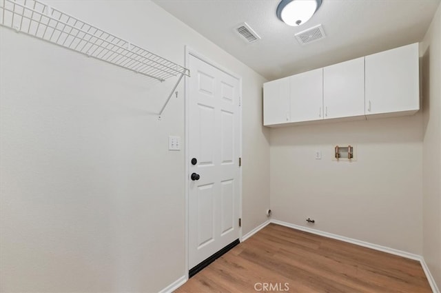 8167 Faircrest Rd, Riverside, CA 92508 - washroom featuring cabinet space, light wood-type flooring, baseboards, and hookup for a washing machine