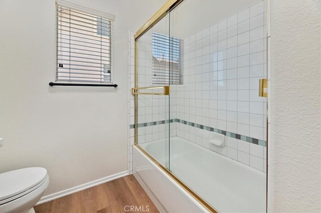 8167 Faircrest Rd, Riverside, CA 92508 - full bathroom with wood finished floors, baseboards, toilet, and enclosed tub / shower combo