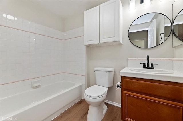 8167 Faircrest Rd, Riverside, CA 92508 - full bathroom with wood finished floors, toilet, vanity, baseboards, and bathing tub / shower combination
