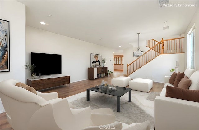 8167 Faircrest Rd, Riverside, CA 92508 - living room featuring stairway, wood finished floors, and recessed lighting
