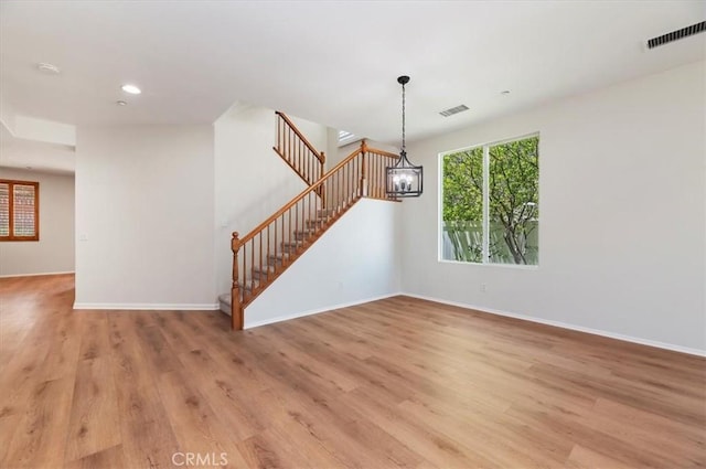 8167 Faircrest Rd, Riverside, CA 92508 - unfurnished living room with a chandelier, light wood-type flooring, baseboards, and recessed lighting