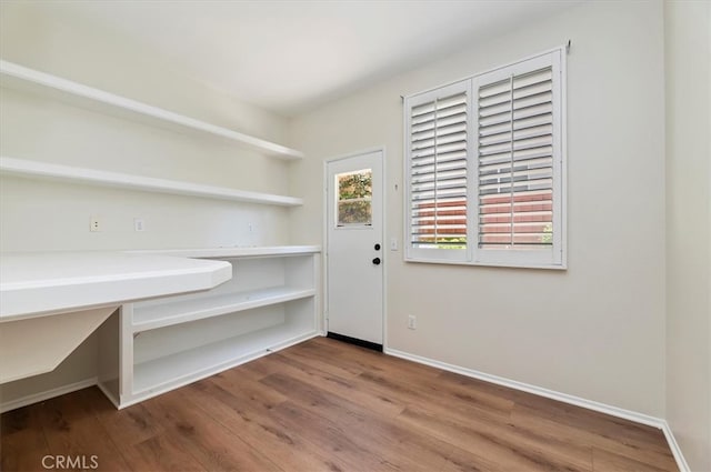 8167 Faircrest Rd, Riverside, CA 92508 - unfurnished dining area with wood finished floors and baseboards