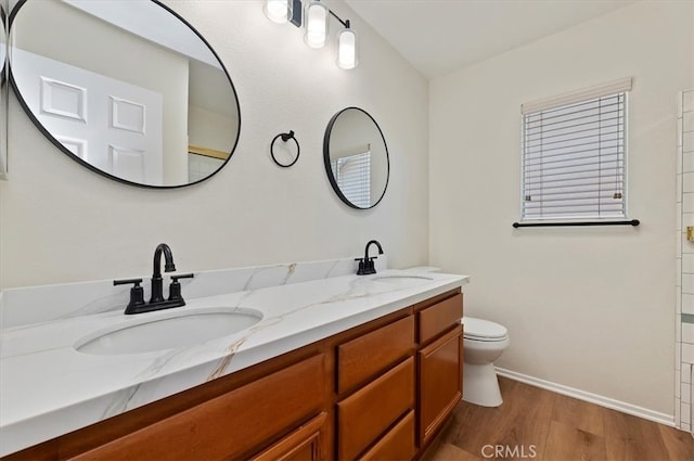 8167 Faircrest Rd, Riverside, CA 92508 - full bath with wood finished floors, baseboards, toilet, and double vanity