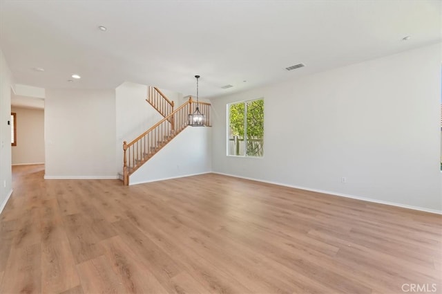 8167 Faircrest Rd, Riverside, CA 92508 - spare room featuring light wood finished floors, baseboards, recessed lighting, and a chandelier