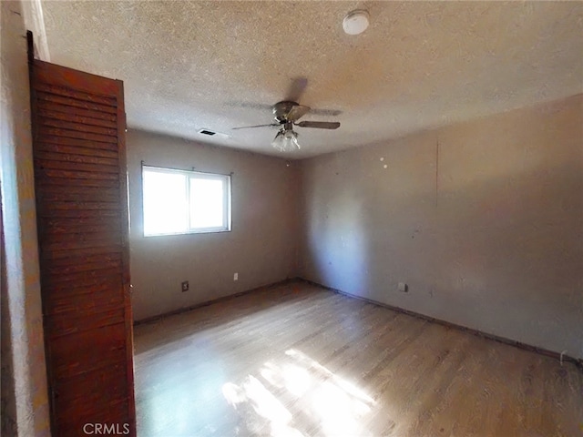 410 5th St, Willows, CA 95988 - spare room with wood finished floors, a ceiling fan, and a textured ceiling