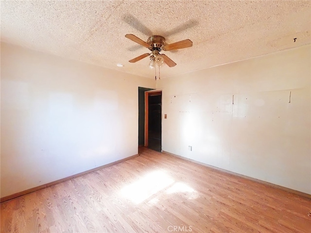 410 5th St, Willows, CA 95988 - unfurnished room with light wood-type flooring, a ceiling fan, a textured ceiling, and baseboards