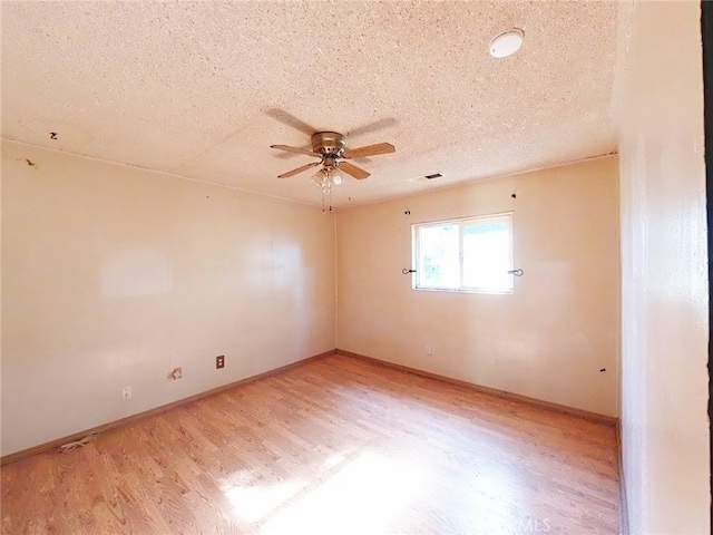 410 5th St, Willows, CA 95988 - empty room featuring light wood-type flooring, a ceiling fan, a textured ceiling, and baseboards