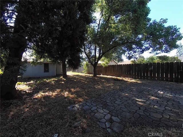 410 5th St, Willows, CA 95988 - fenced backyard with a patio area and an outbuilding