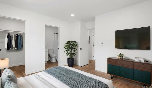 5259 Imperial Ave, San Diego, CA 92114 - bedroom with wood finished floors, a closet, baseboards, recessed lighting, and ensuite bathroom