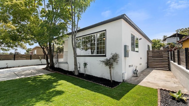 5259 Imperial Ave, San Diego, CA 92114 - view of side of home featuring stucco siding and a patio