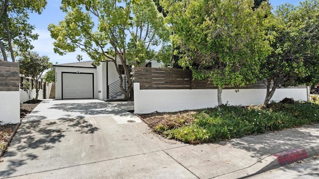 5259 Imperial Ave, San Diego, CA 92114 - view of front of home with concrete driveway, fence, a garage, and stucco siding