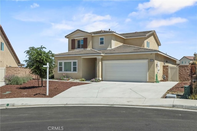 30527 Expedition Dr, Winchester, CA 92596 - traditional-style house with an attached garage, stucco siding, driveway, a tiled roof, and a gate