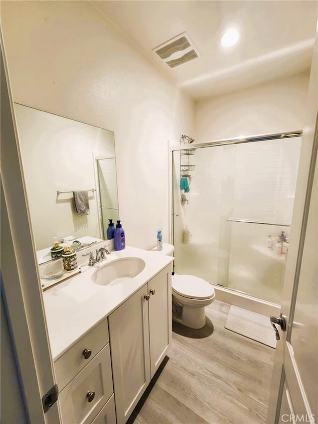 30527 Expedition Dr, Winchester, CA 92596 - bathroom featuring wood finished floors, vanity, and a stall shower