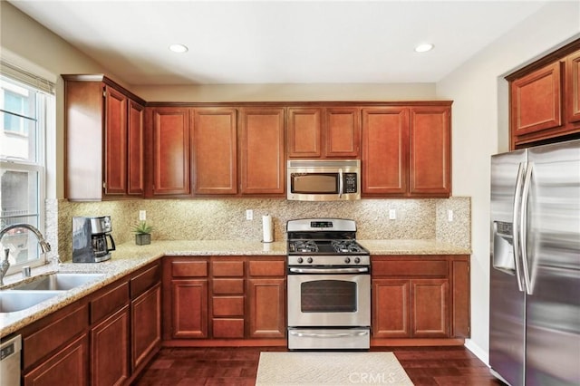 4437 Owens St Unit 104, Corona, CA 92883 - kitchen with appliances with stainless steel finishes, a sink, backsplash, dark wood finished floors, and recessed lighting