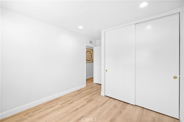 20 Grant, Irvine, CA 92620 - unfurnished bedroom with light wood-type flooring, recessed lighting, baseboards, and a closet