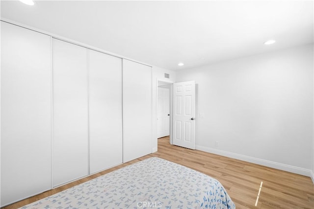 20 Grant, Irvine, CA 92620 - bedroom featuring a closet, recessed lighting, wood finished floors, and baseboards
