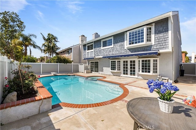20 Grant, Irvine, CA 92620 - view of swimming pool with french doors, a patio area, a fenced backyard, a pool with connected hot tub, and a diving board
