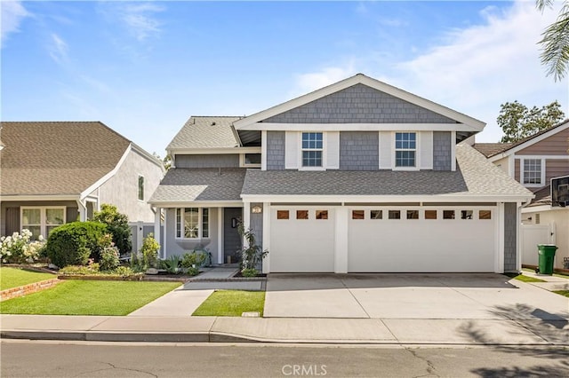 20 Grant, Irvine, CA 92620 - view of front facade with concrete driveway, a garage, and a shingled roof