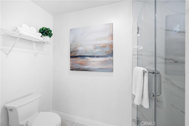 20 Grant, Irvine, CA 92620 - bathroom with a marble finish shower, toilet, marble look tile flooring, and baseboards