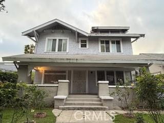view of front of property featuring covered porch