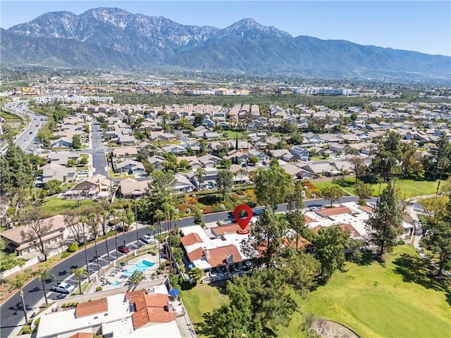 aerial view of property's location with mountains and nearby suburban area