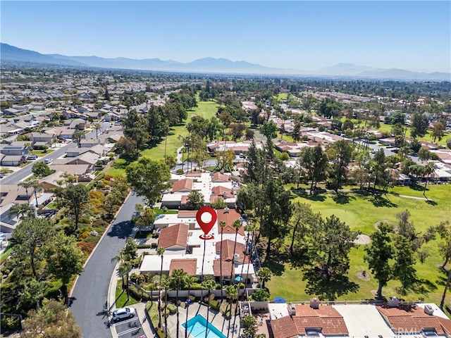 aerial perspective of suburban area with a mountainous background